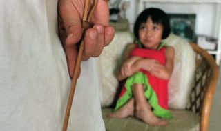 A child waiting to be caned