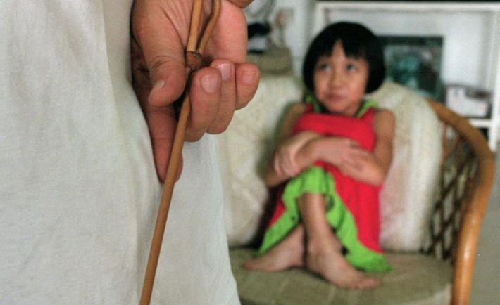 A child waiting to be caned