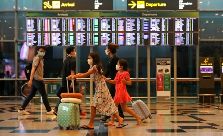 Travellers in masks