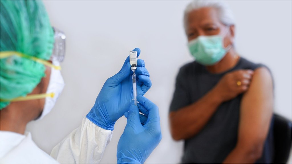 man taking a vaccine