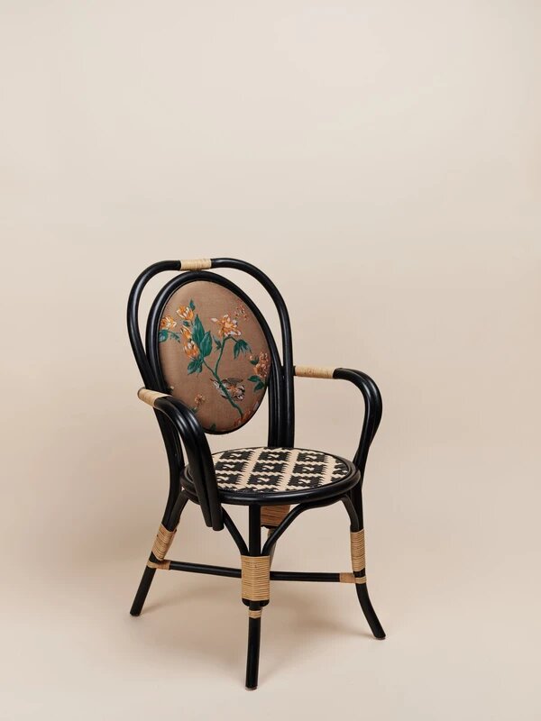 natural rattan dining chair in a black finish