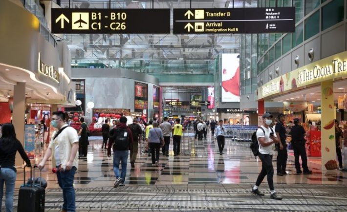 Changi Airport with people in masks