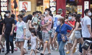 Singapore residents crossing the road