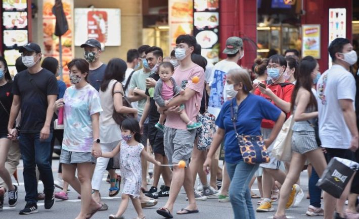 Singapore residents crossing the road