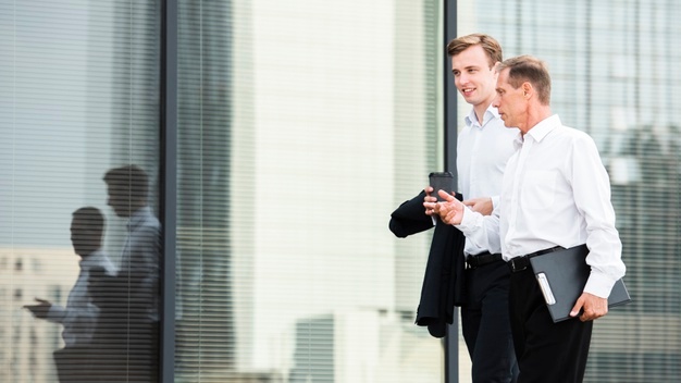 businessmen-discussing-while-walking