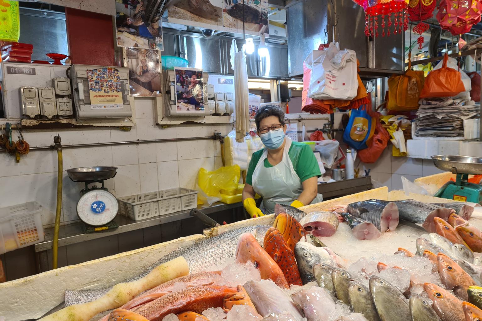 a fishmonger at Ghim Moh Market & Food Centre