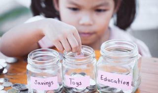 a kid with money jars