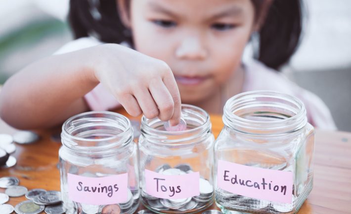 a kid with money jars