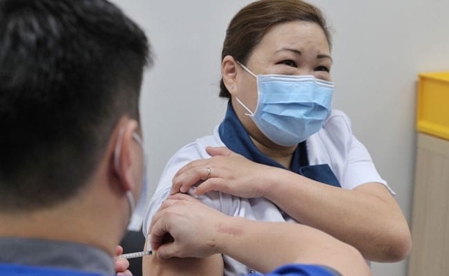 a lady getting vaccinated