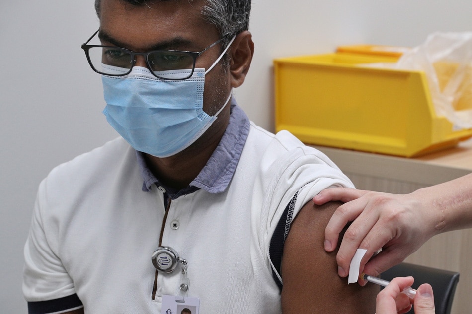 a man receiving the COVID-19 vaccine