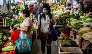 women shopping at a wet market