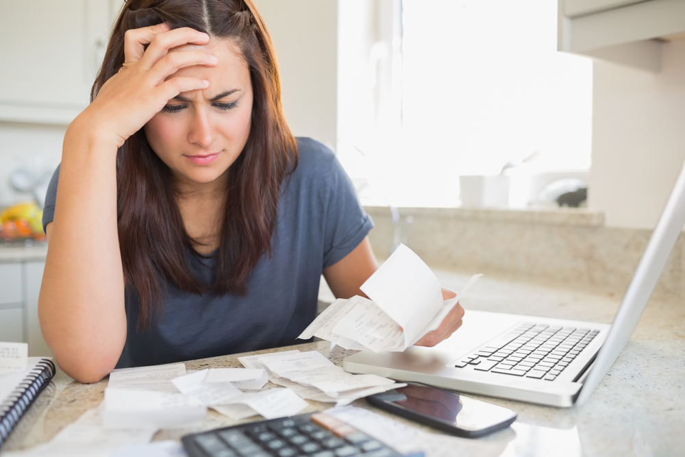 a woman looking at her bills