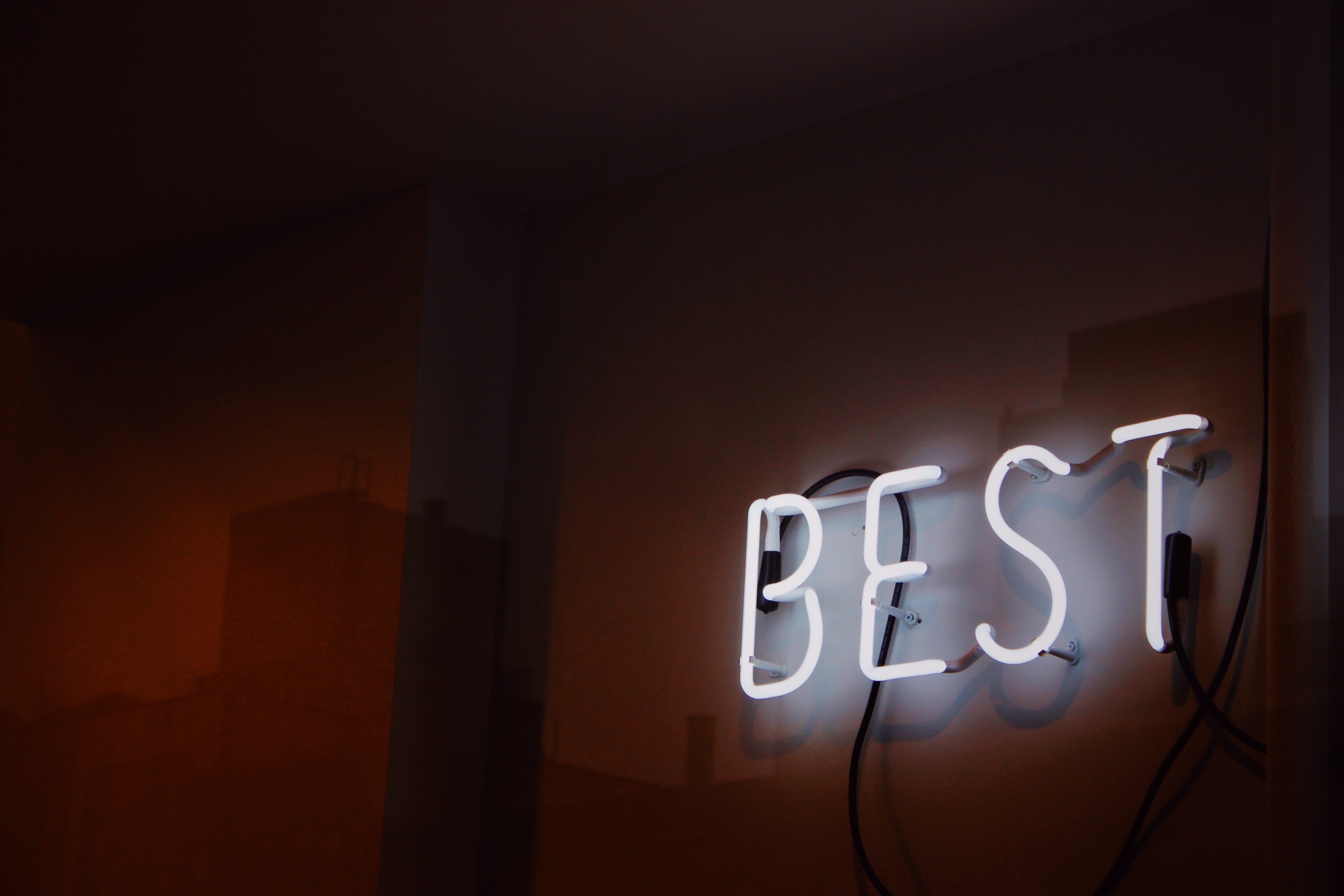 a neon sign that reads 'best'