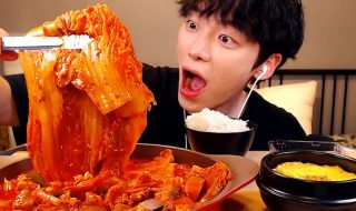 korean holding a kimchi cabbage