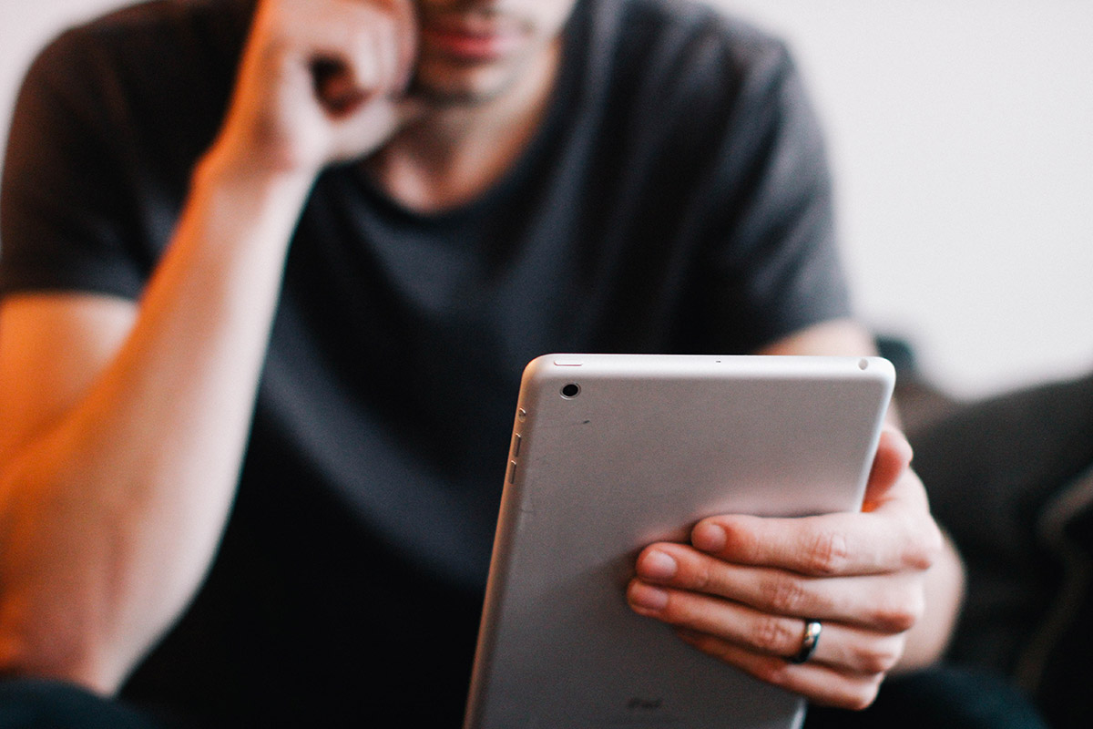 man-reading-on-ipad