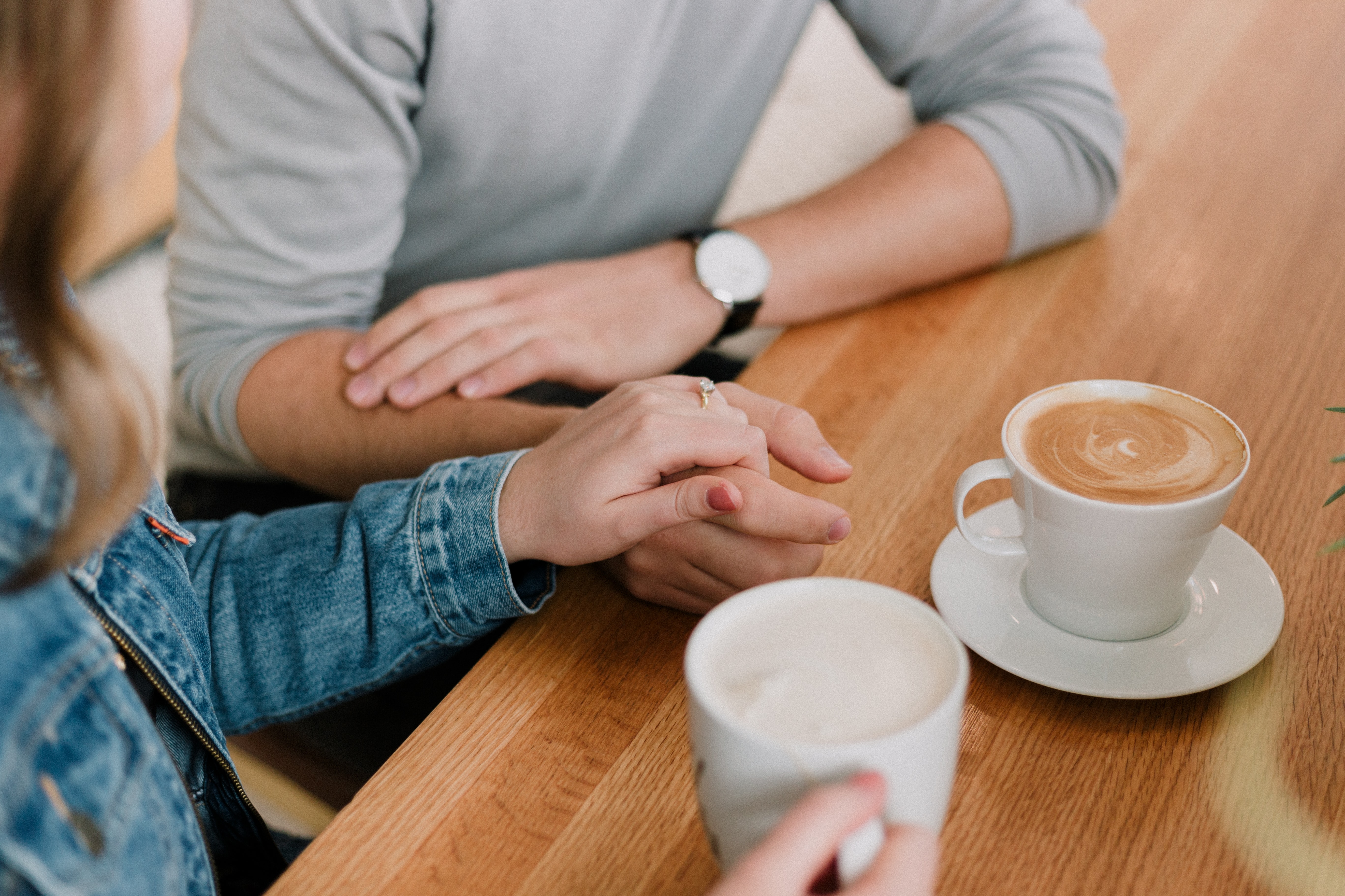 a couple talking over coffee