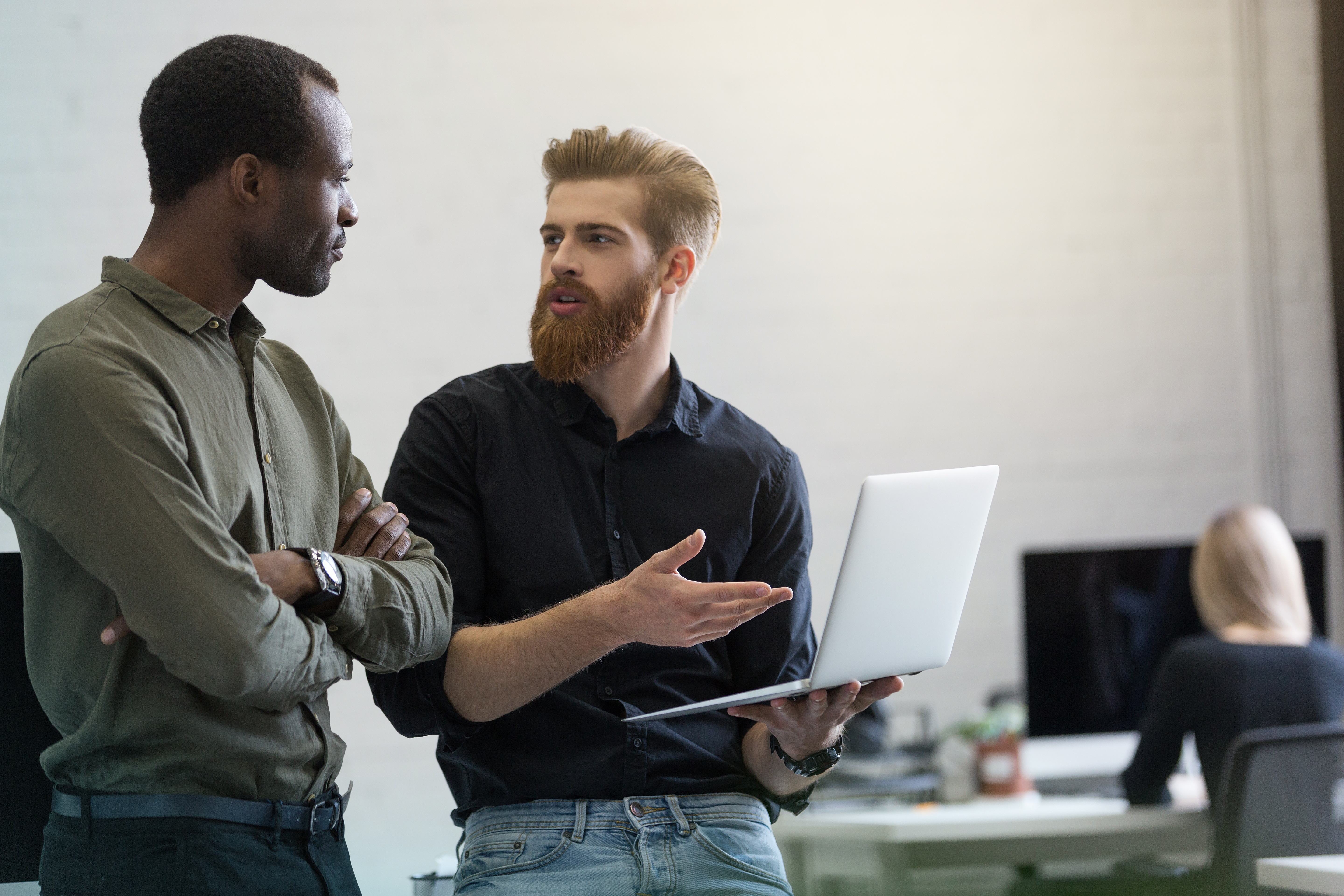 Two young businessmen discussing new project