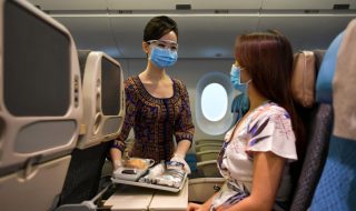 SIA stewardess with a passenger