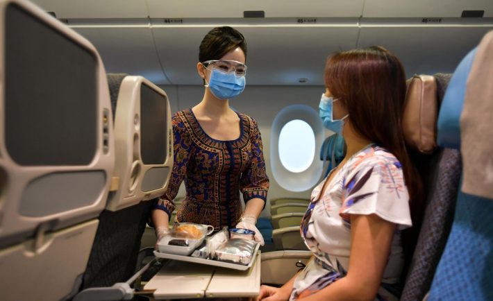 SIA stewardess with a passenger