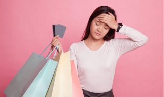 an asian lady holding on to shopping bags