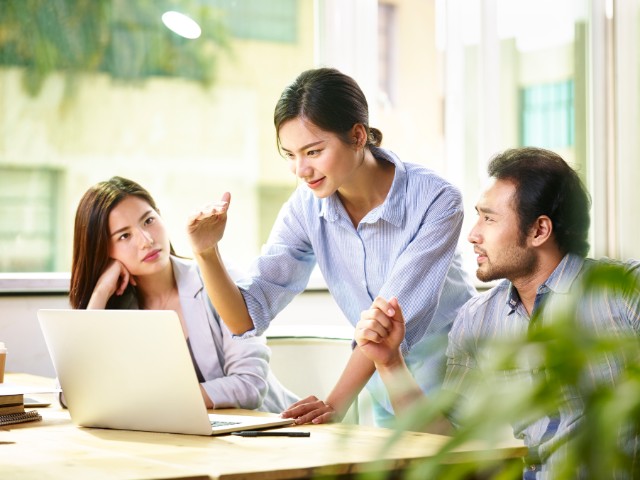 a female colleague motivating her coworkers