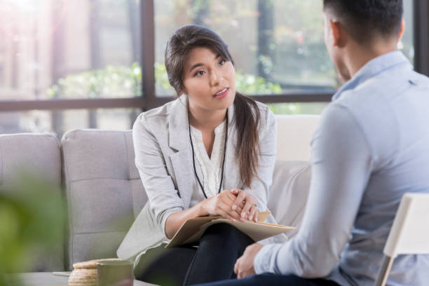 a woman listening intently to a man