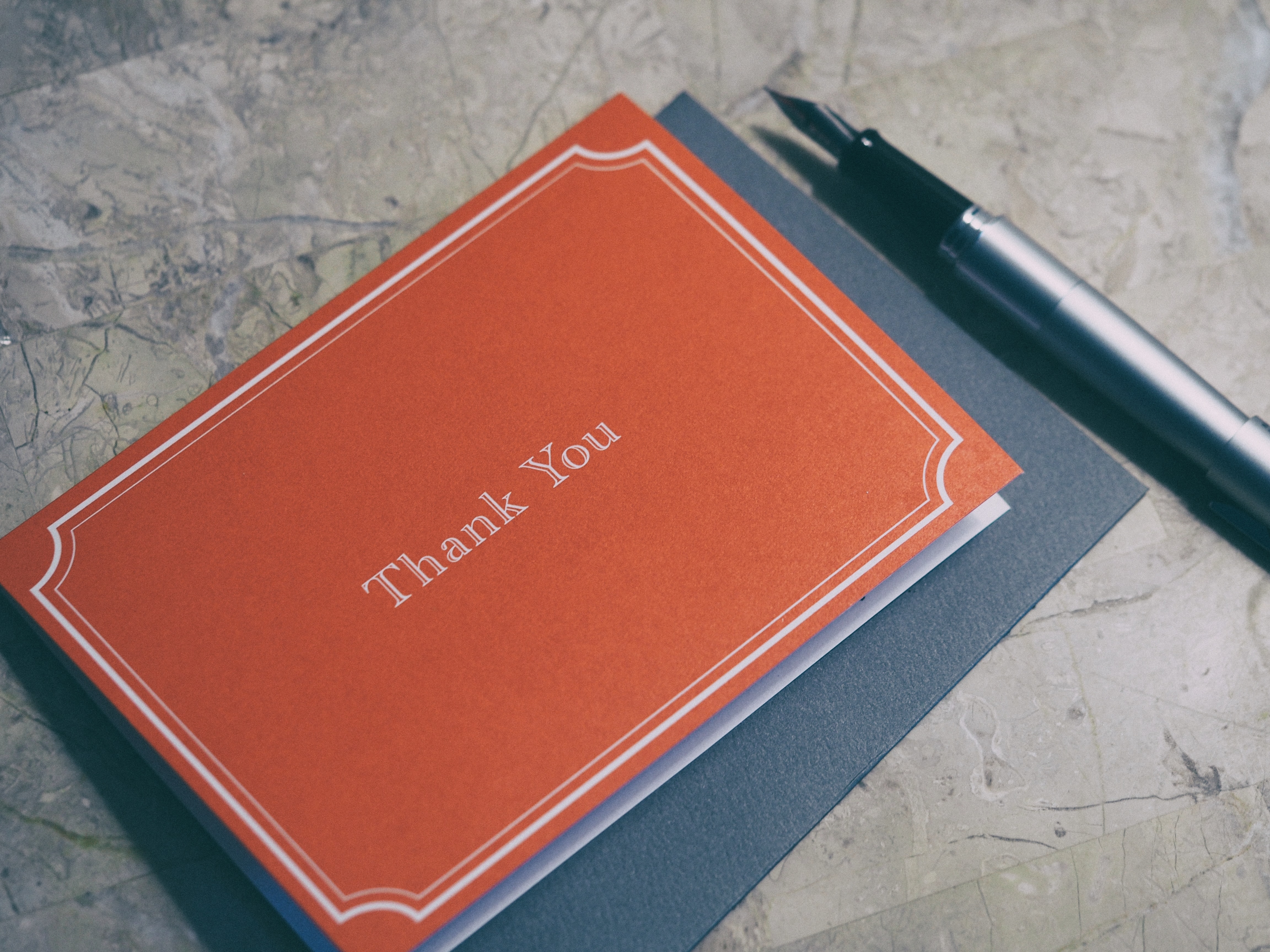 an orange thank you card