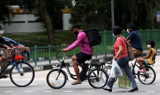 cyclists and pedestrians crossing the road