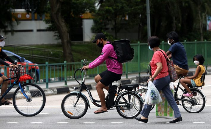 cyclists and pedestrians crossing the road