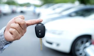 a man holding on to his car key