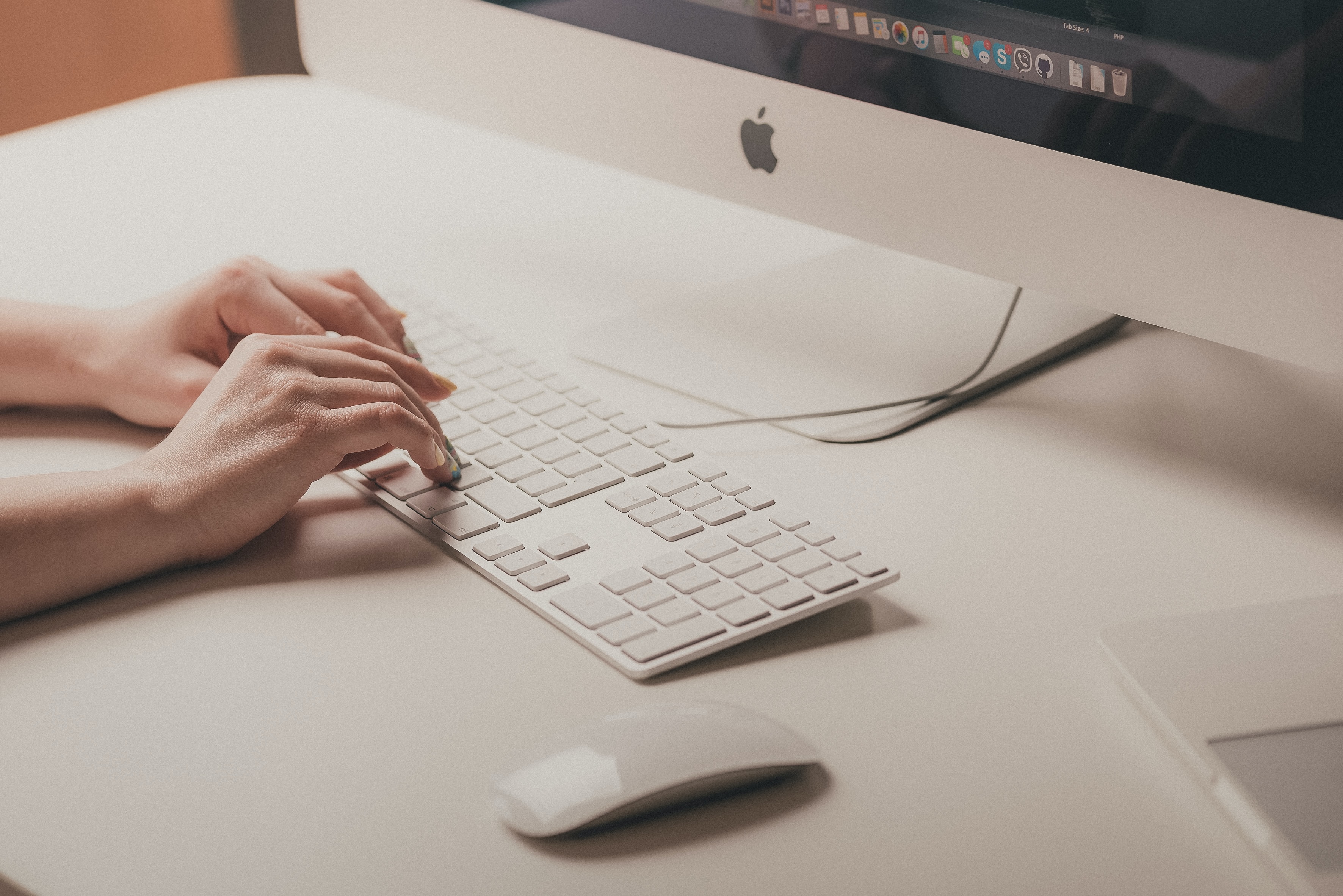 typing on an Apple keyboard