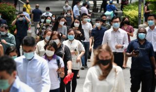 Singapore residents crossing the road