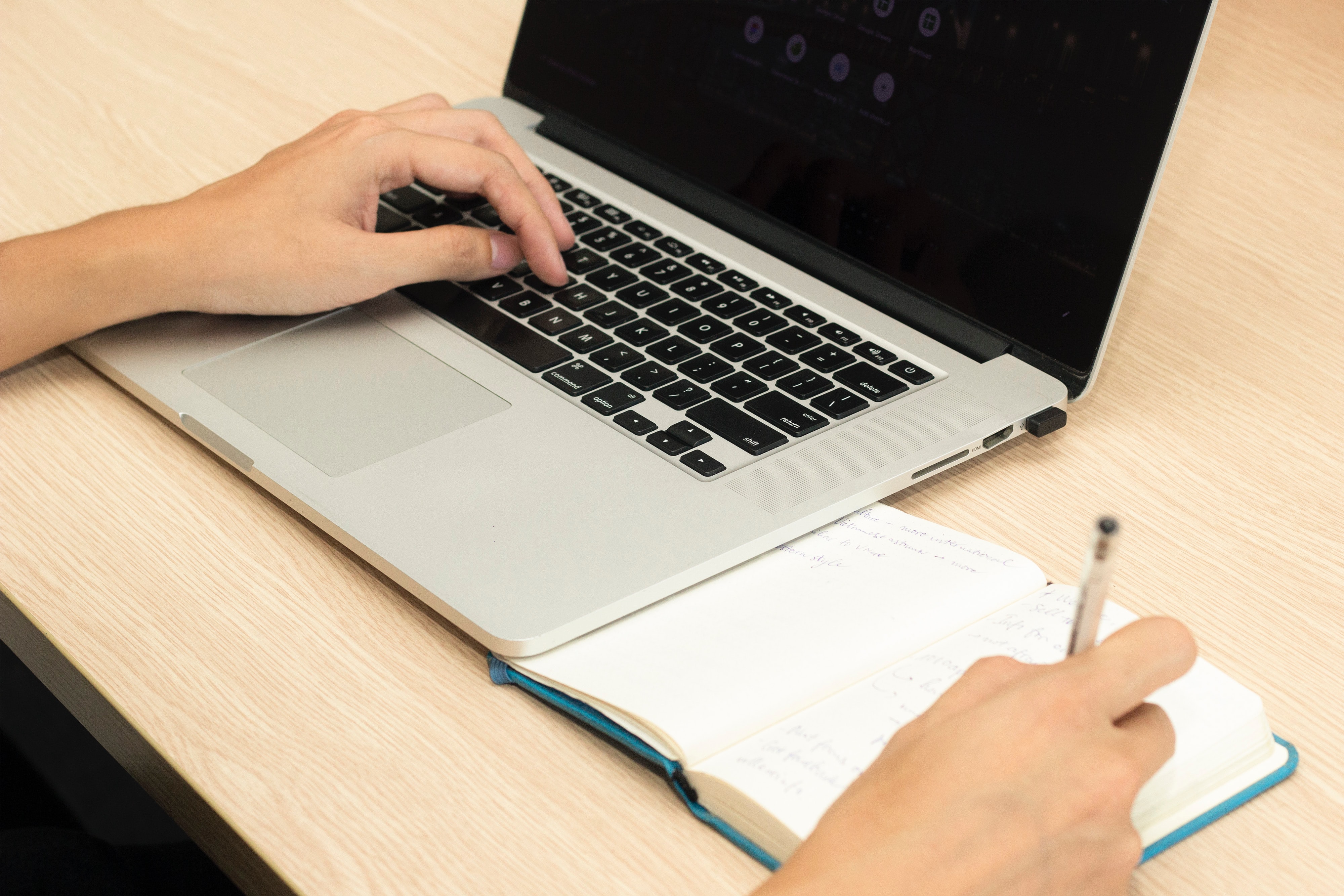 a person using laptop while researching