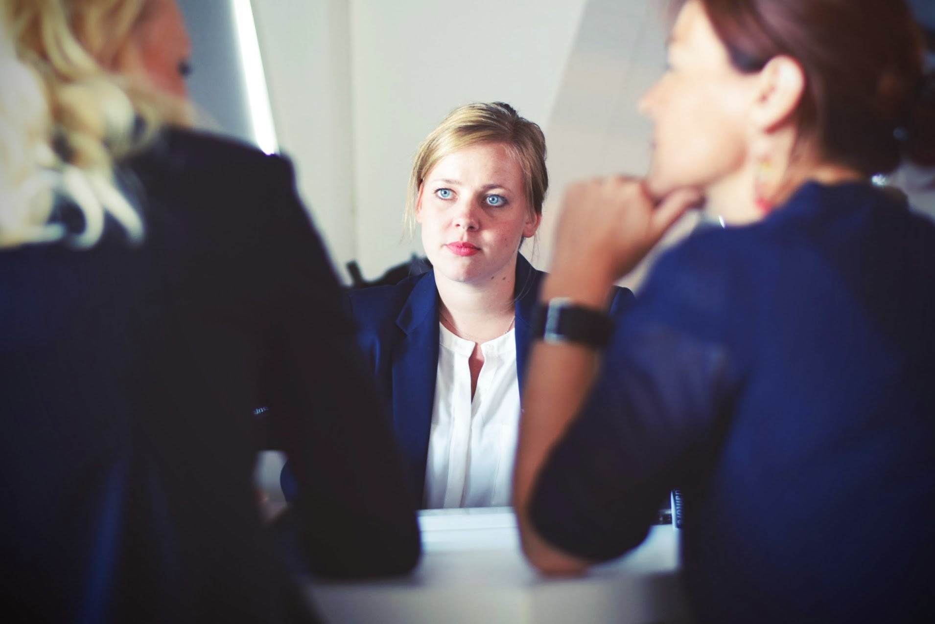 a woman listening to her colleagues