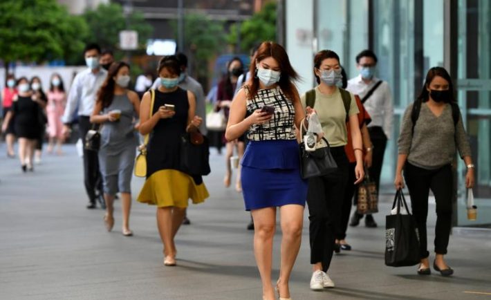 Singapore residents heading to work