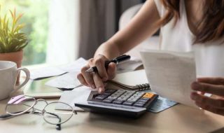 a woman calculating her expenses