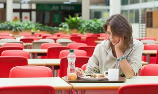 a woman eating alone