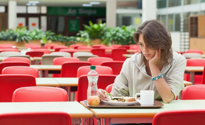 a woman eating alone