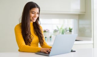 a young woman using her laptop