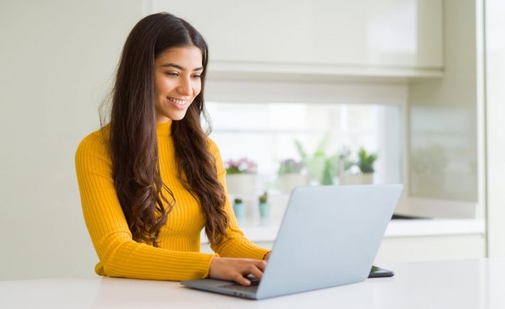 a young woman using her laptop