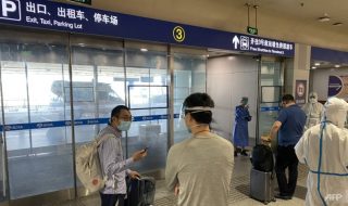 inbound passengers waiting to be taken to quarantine-designated destinations