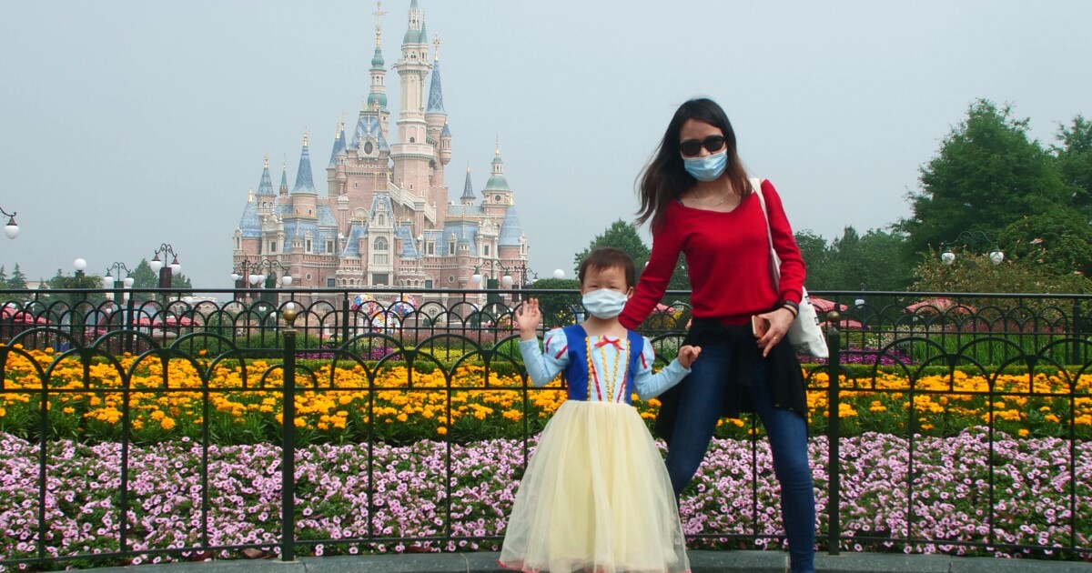 woman and daughter poses at Shanghai Disneyland