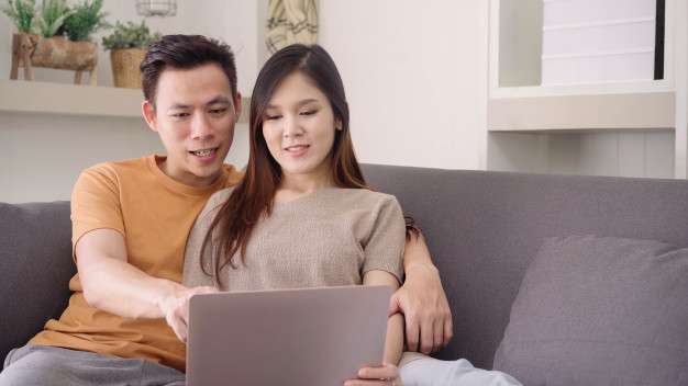 Asian couple using a laptop