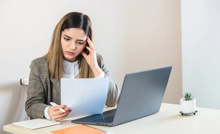 a job seeker looking at her resume