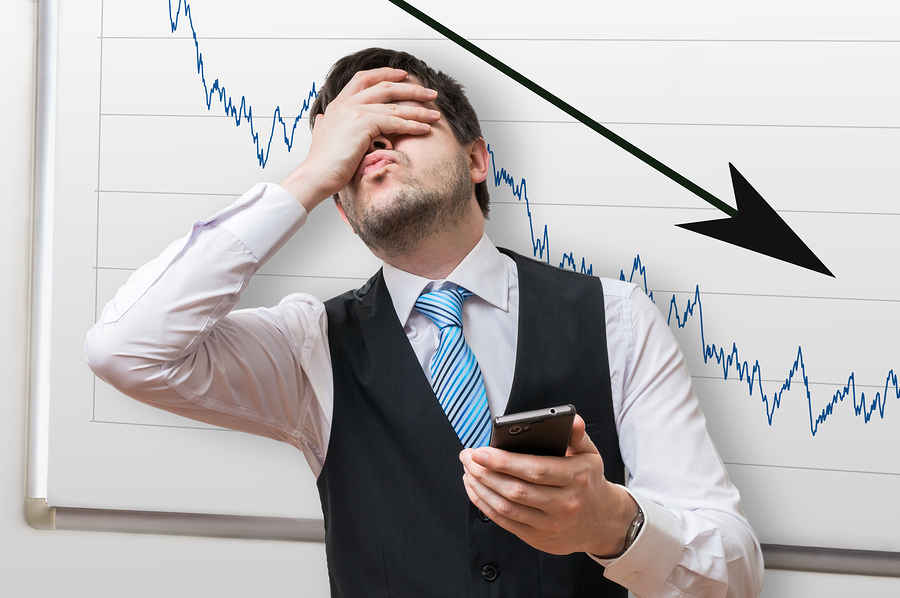 a man stressed over declining profits