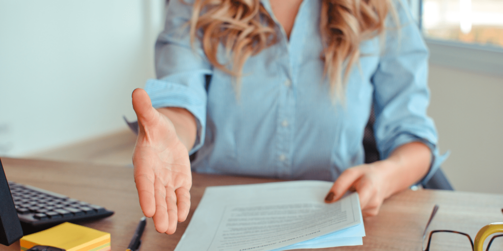 a recruiter extending her hand