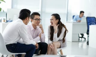 colleagues gossiping in the office