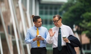 colleagues talking while walking