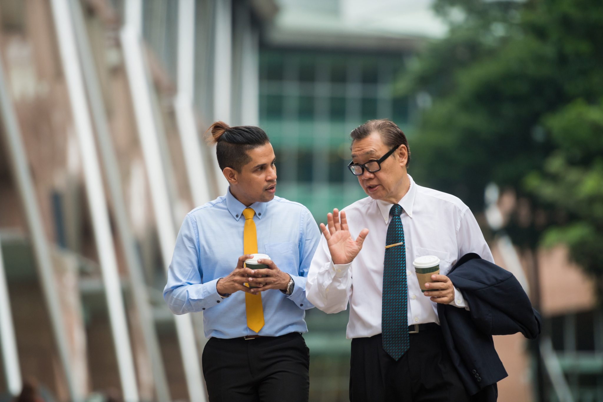 colleagues talking while walking