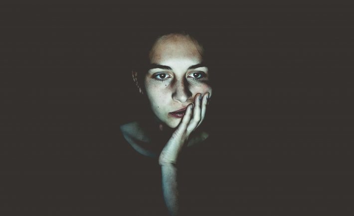 a woman worrying in front of her screen